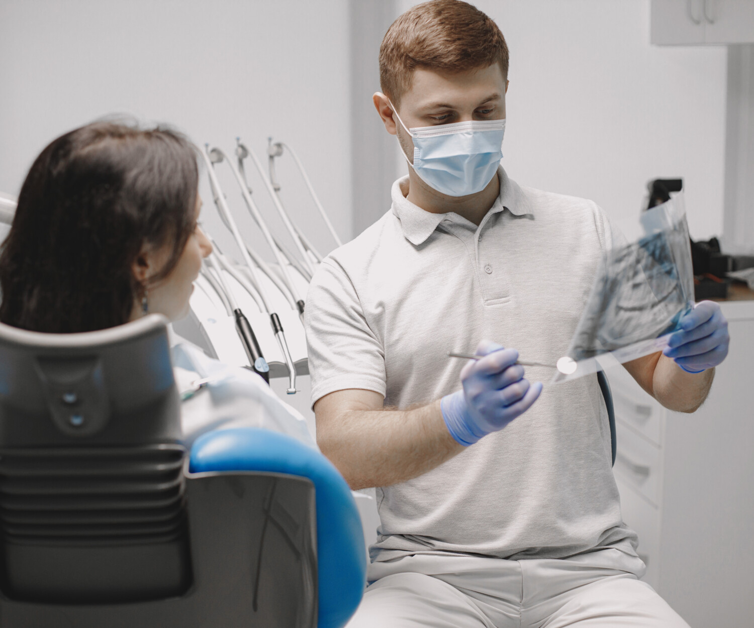 Dentist checking an x-ray.