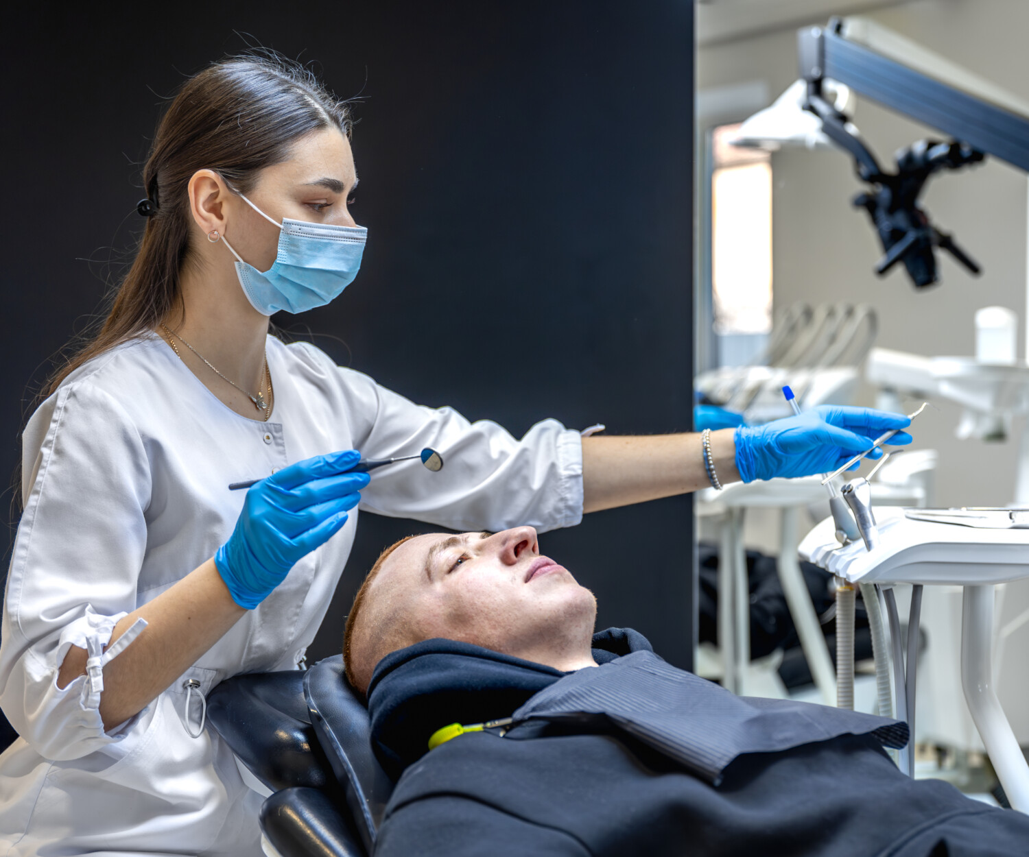 Dentist performing a routine checkup.