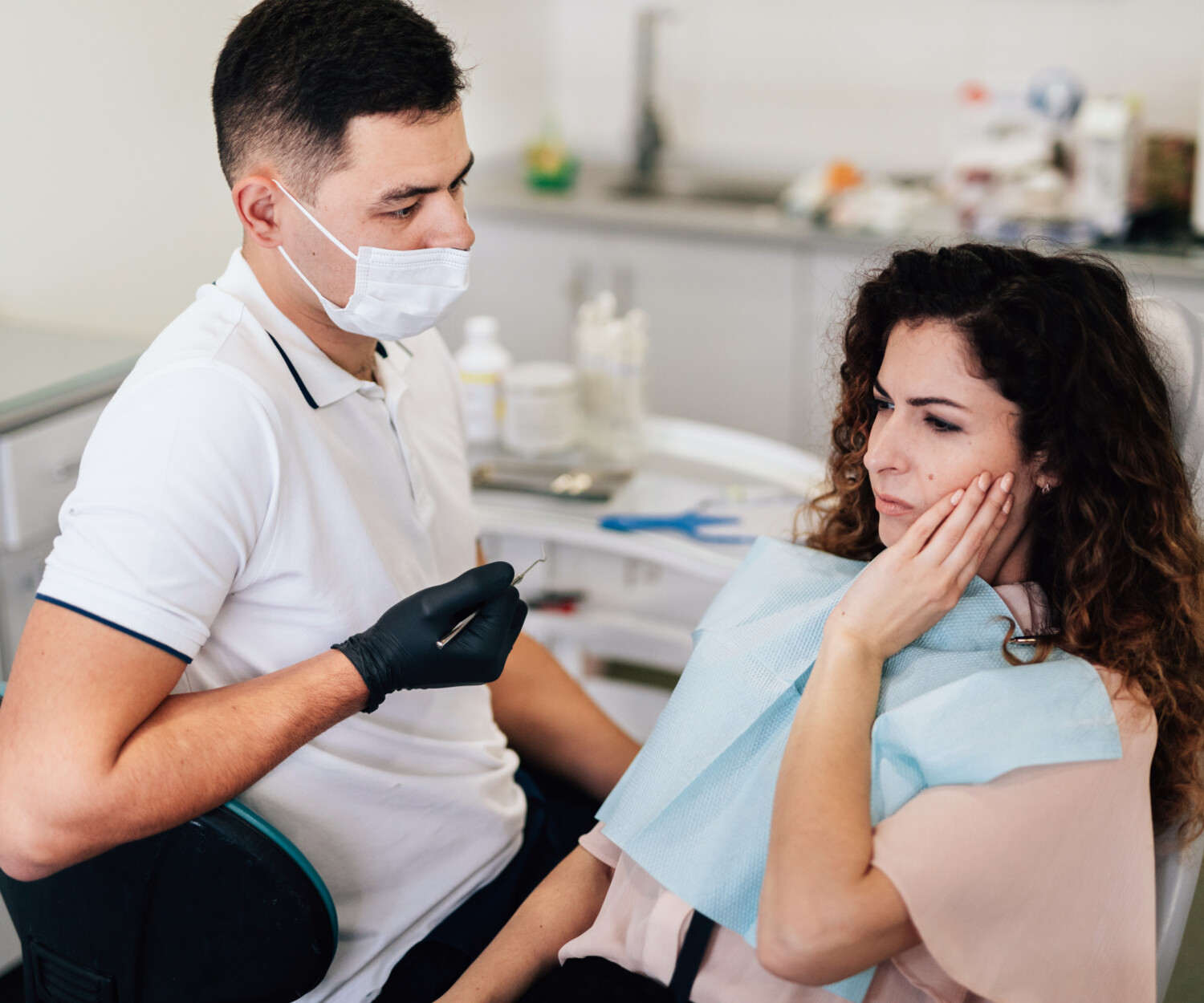 Woman getting her toothache checked.
