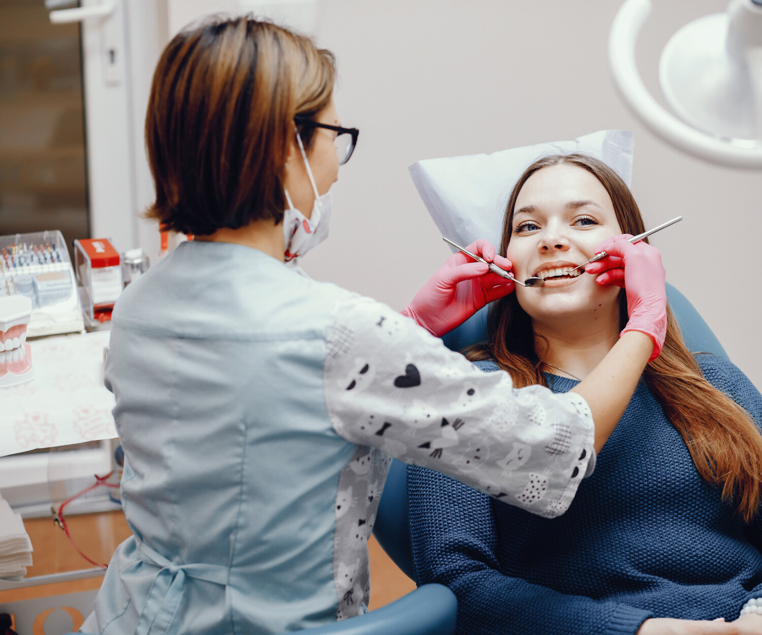Woman undergoing a routine dental checkup.