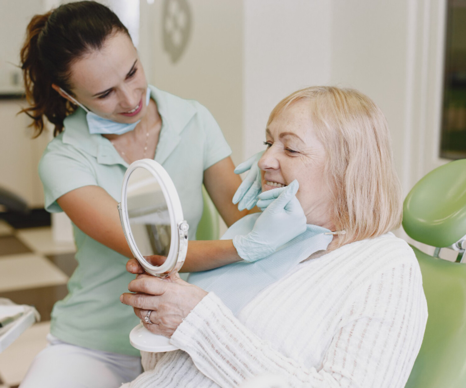 Senior woman having dental treatment at dentist's office