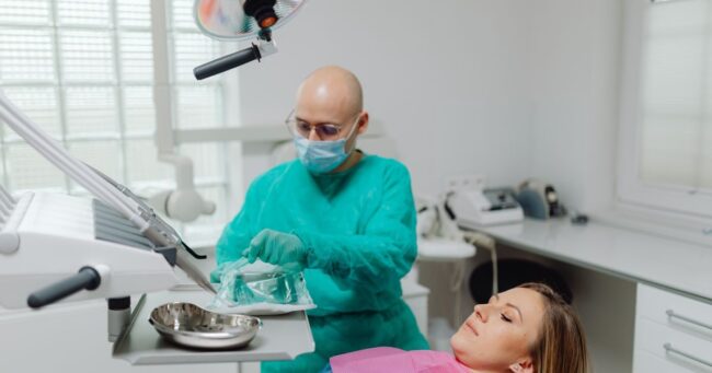 Dentist preparing for a patient's tooth extraction