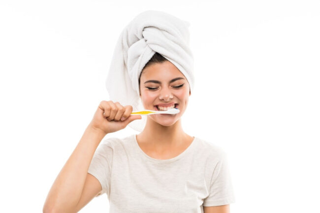 Woman brushing teeth