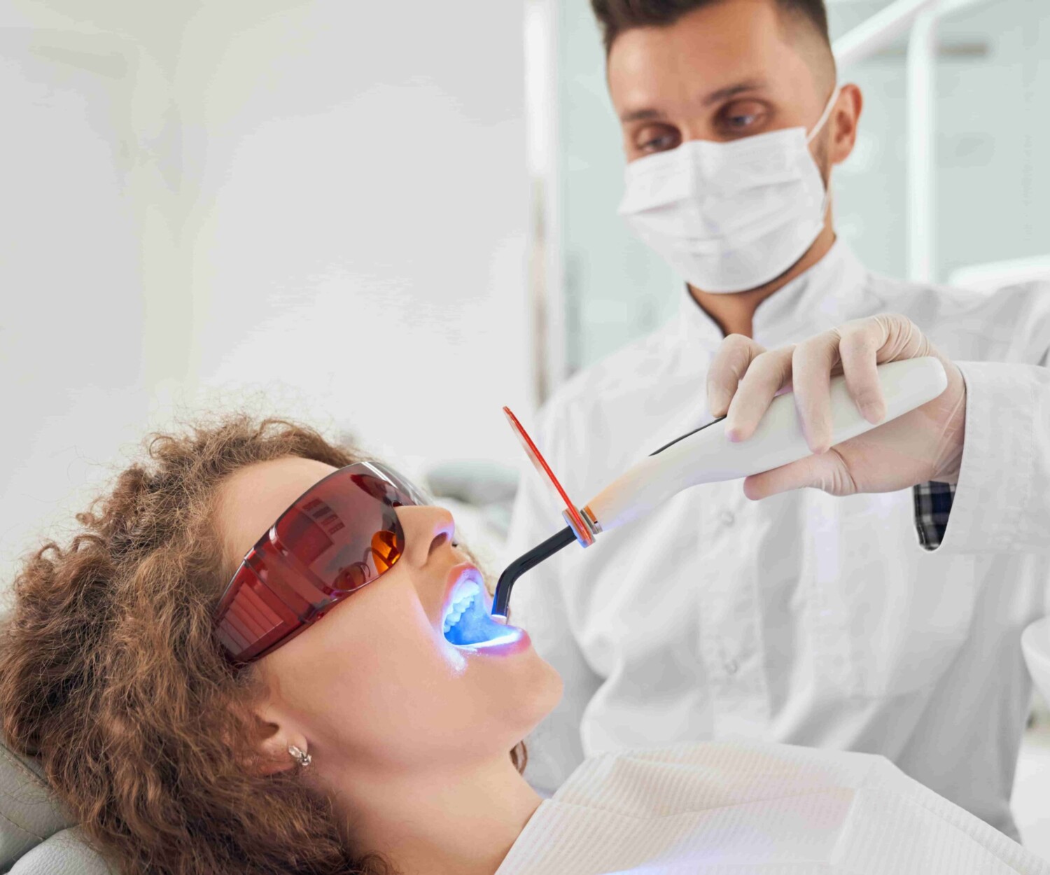 patients getting teeth whitening treatment