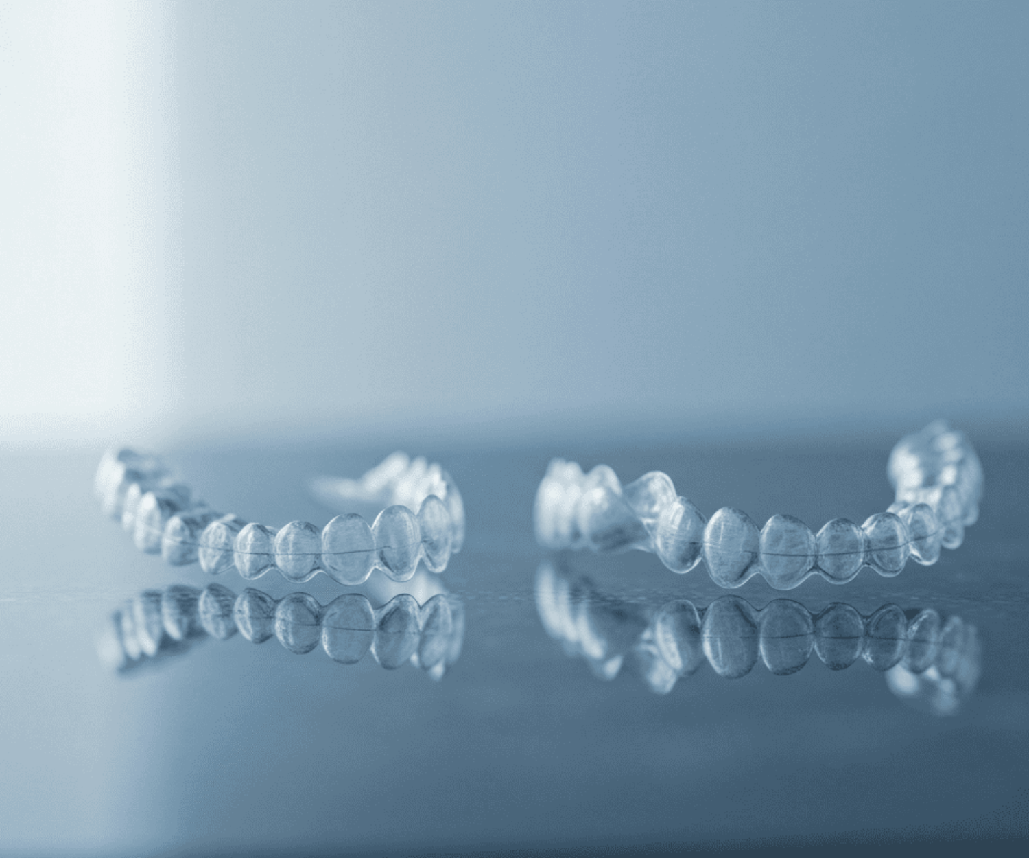 Invisalign aligners on blue background