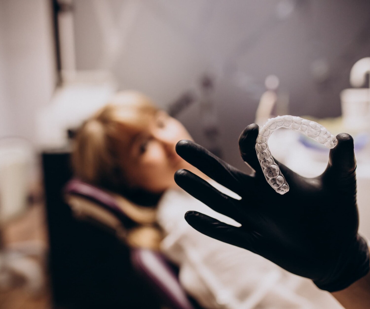Dentist holding invisalign tray