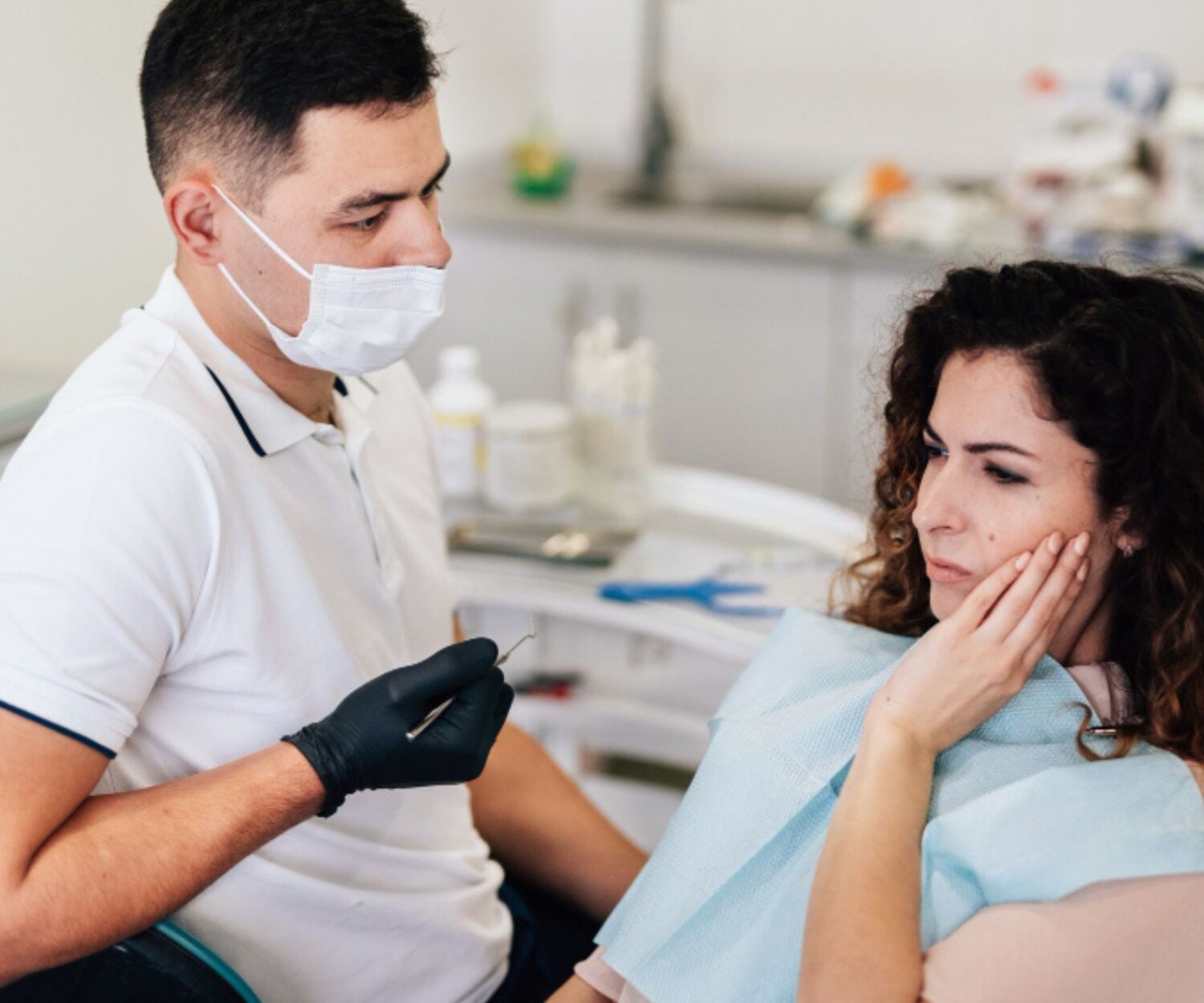 Woman with toothache at dentist
